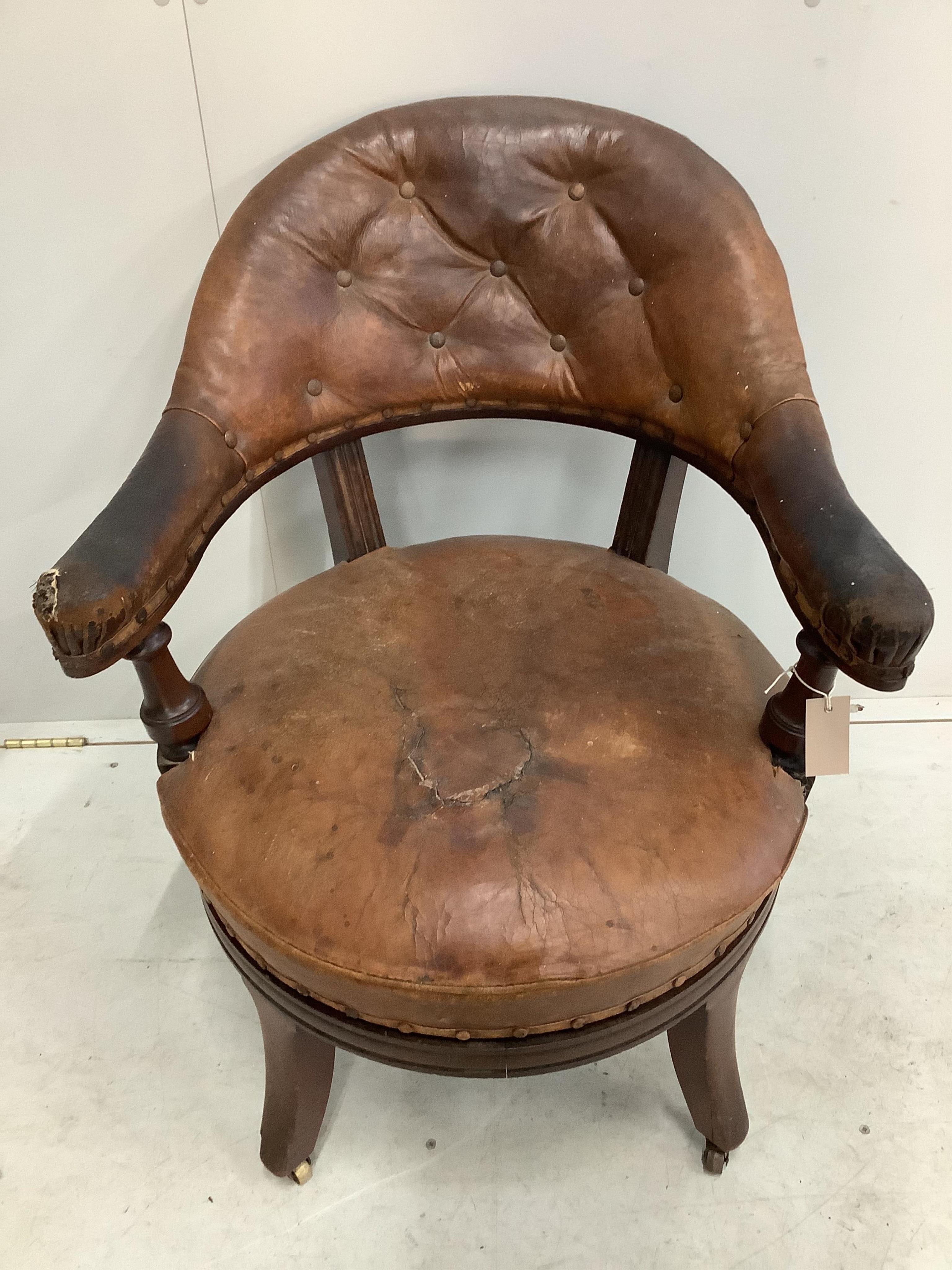 A 19th century Holland & Son leather button back office chair (missing one castor), width 65cm, depth 56cm, height 80cm. Condition - poor